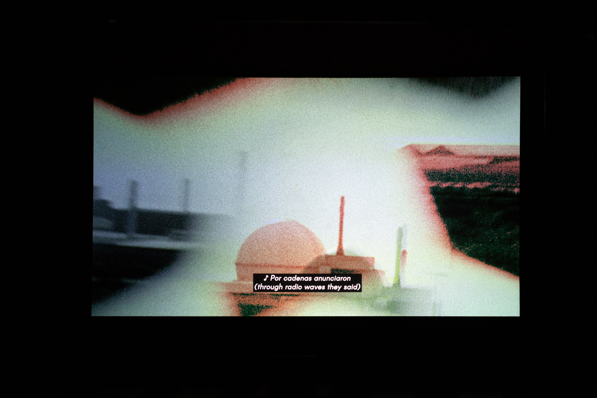 Image of projected screen featuring a still from the film BARRUNTO