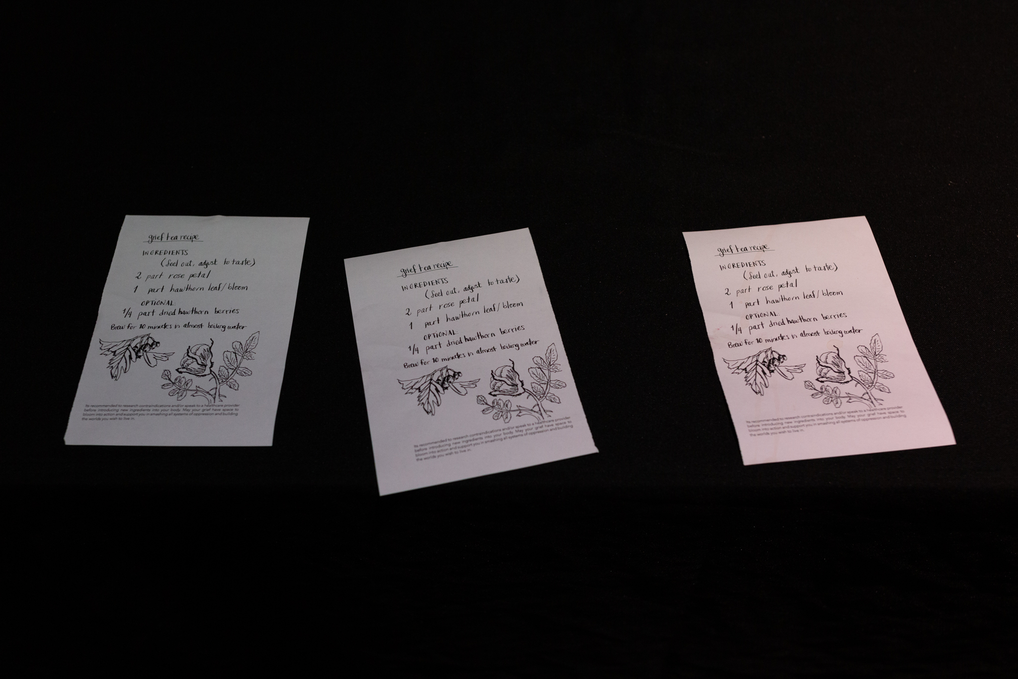 3 sheets of paper with the ingredients for grief tea. The text is handwritten with a botanical drawing at the bottom in blank ink