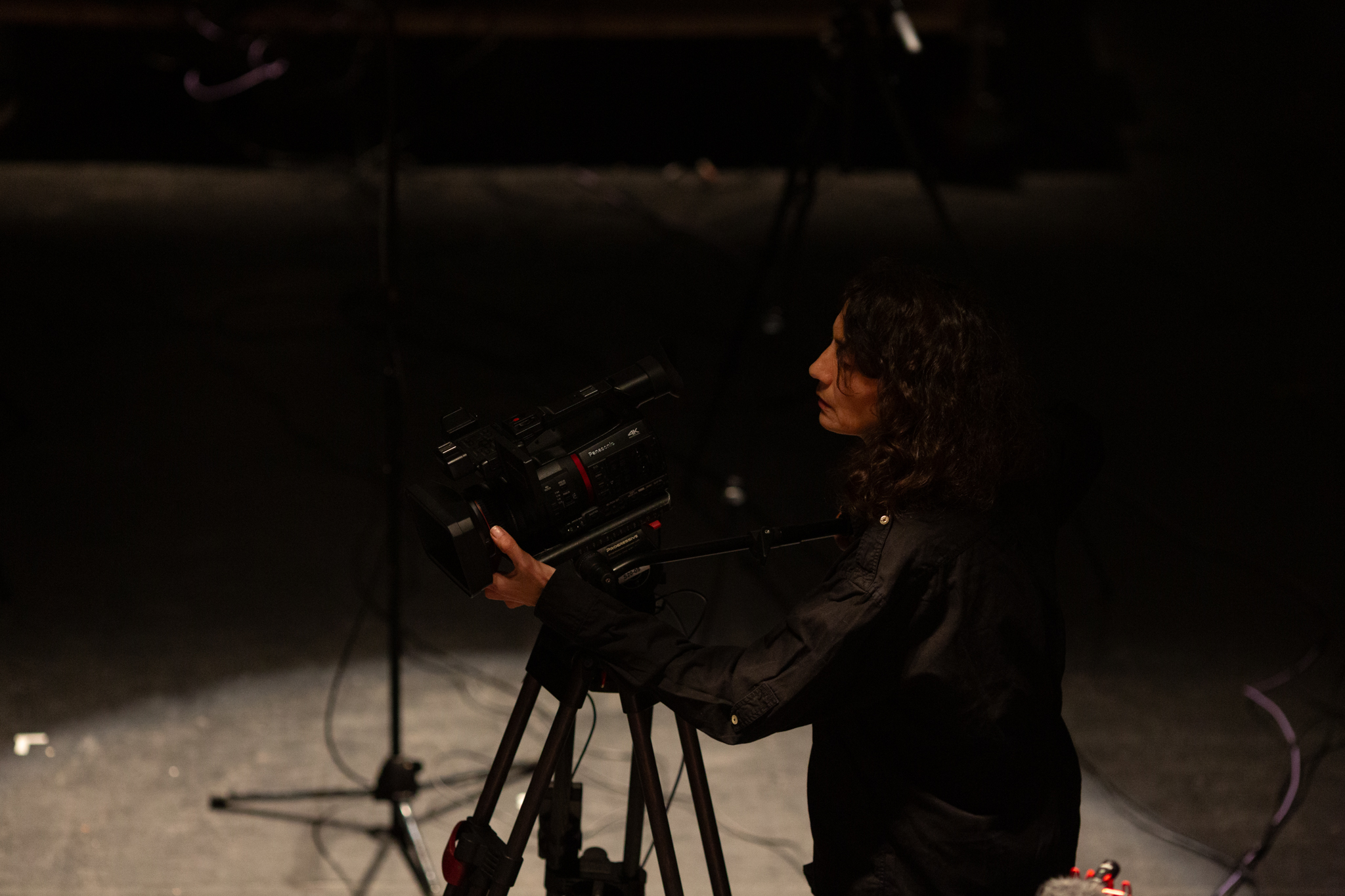 Someone operates a large video camera