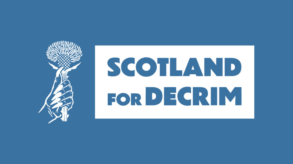 Logo Scotland for Decrim in blue text on white background.