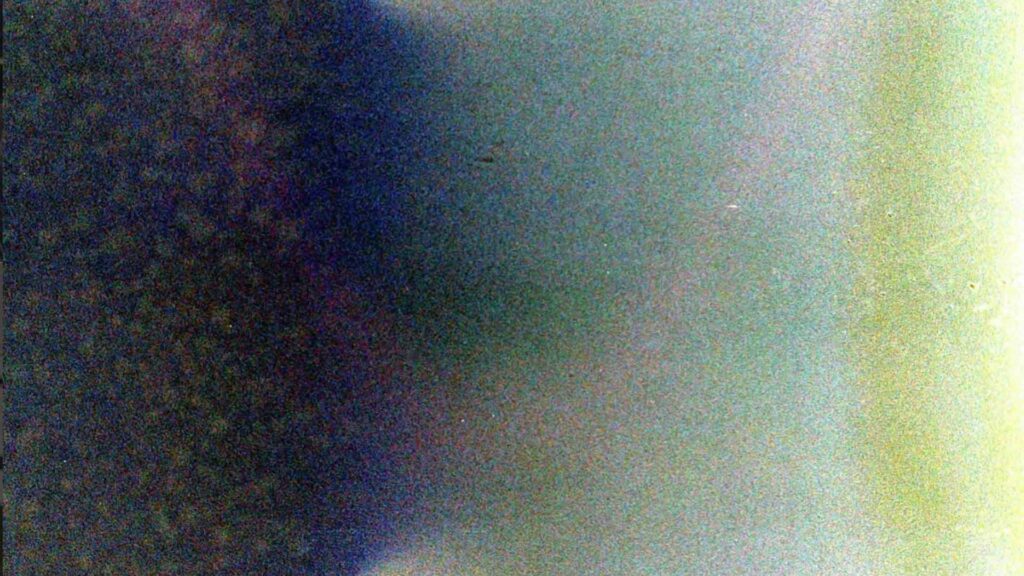 A close up scan of a grainy colourful photo asset.